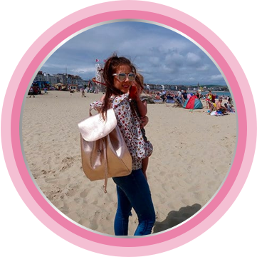 Parent carrying a bag with baby essentials, including a baby cream.